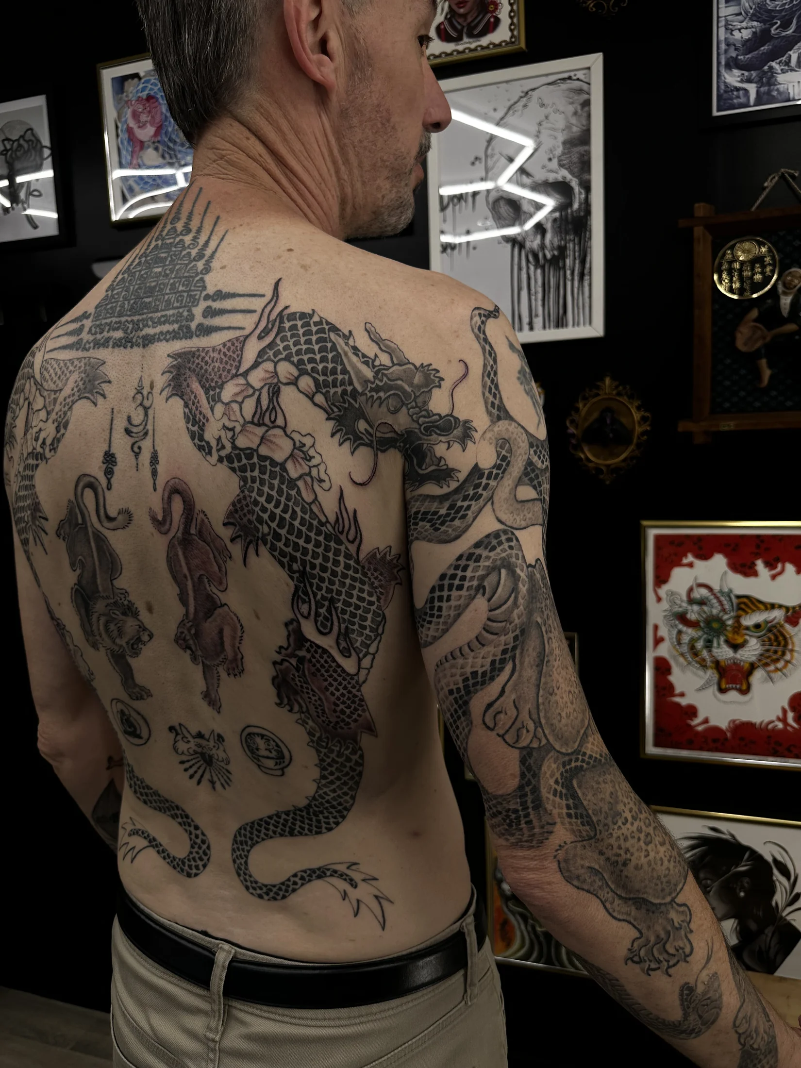 Custom Japanese dragon back and arm tattoo by Suze Tattoos, London