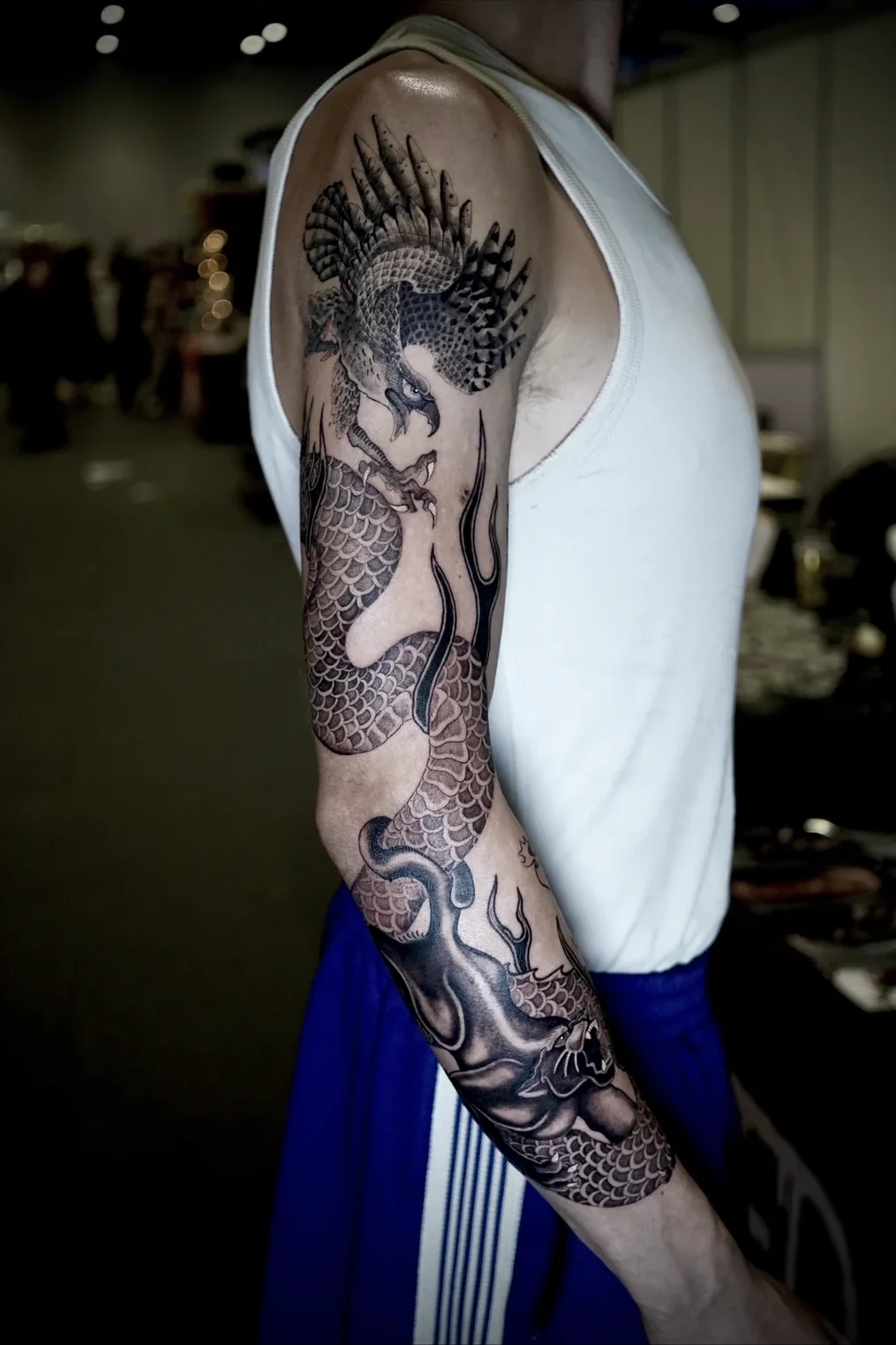 Custom black and grey Japanese dragon sleeve tattoo by Suze Tattoos, London